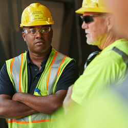 two consumers energy workers chatting